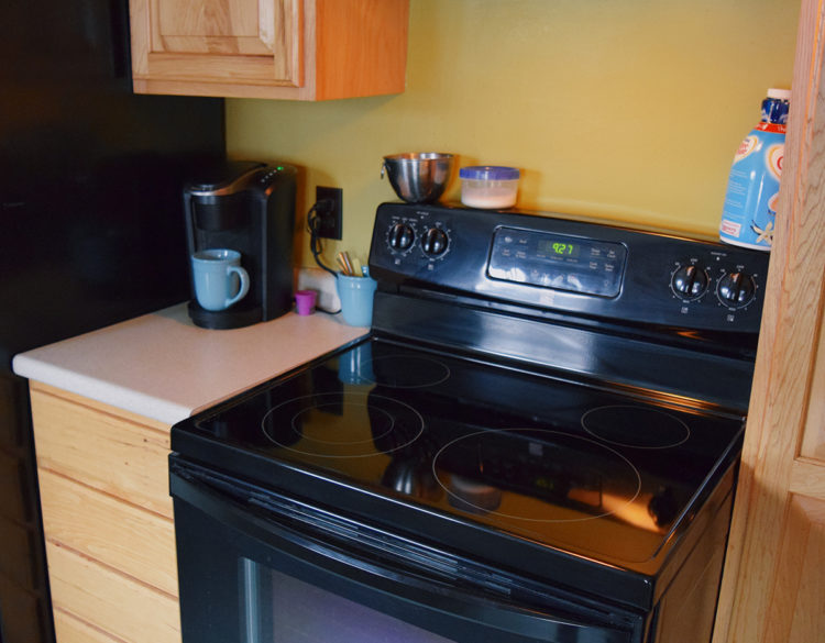 Clean stove and kitchen cabinets