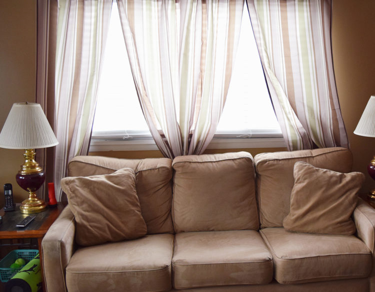Comfy couch in front of bright window