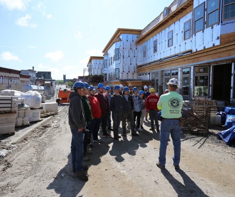 Casler Masonry’s Robert Brotherton speaks with a group of FEH BOCES students and instructors during their tour of the Harison Place project in downtown Malone.