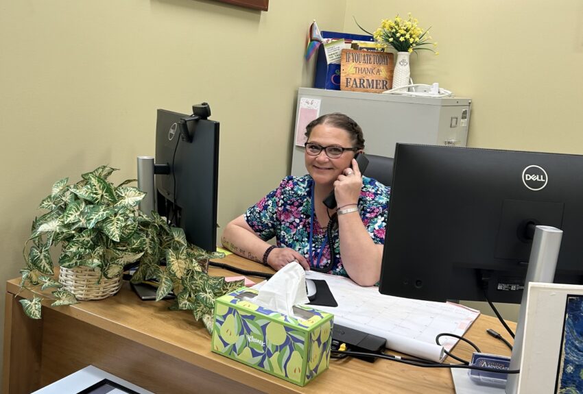 Kirsti Davis, RN speaks with a client on the phone.