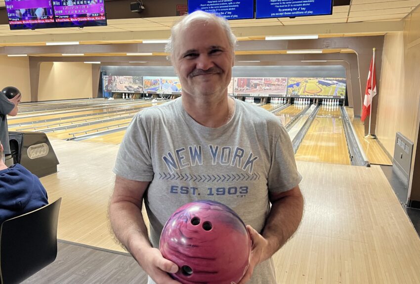 A man holding a bowling ball