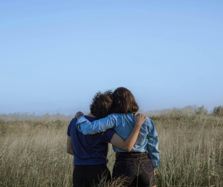 A heartwarming image of two women hugging on International Overdose Awareness Day, representing the strength and connection found through addiction recovery programs.