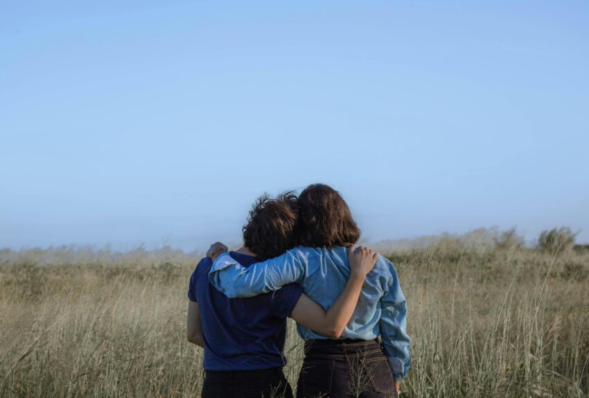 A heartwarming image of two women hugging on International Overdose Awareness Day, representing the strength and connection found through addiction recovery programs.