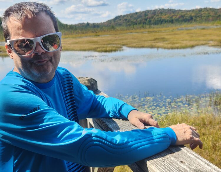 A community club member enjoys a nature walk.