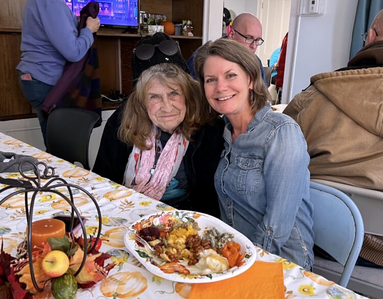 Community club members and staff enjoy a holiday celebration.