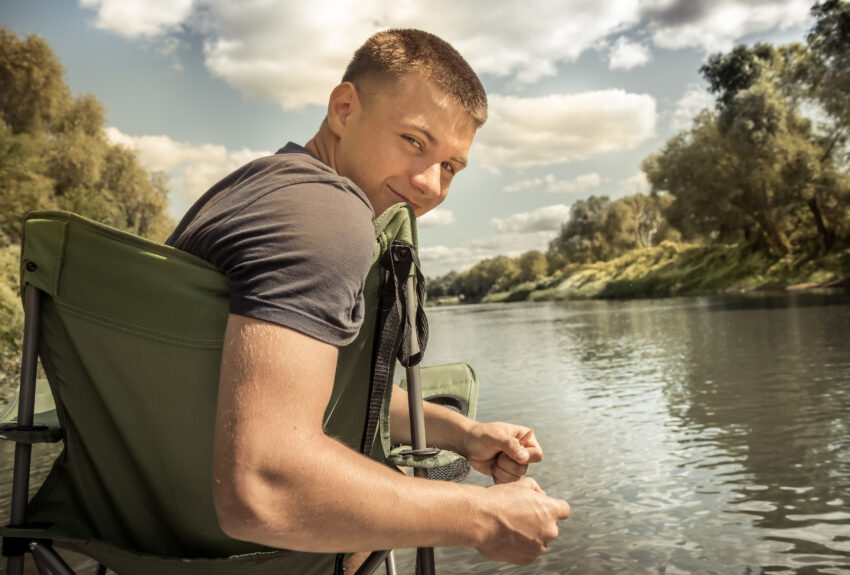 A teenager sits by the river, enjoying life after learning of the dangers of vaping.