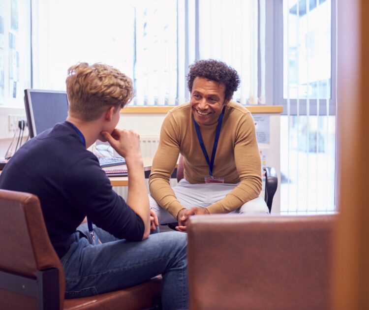 A counselor uses motivational interviewing to help a client.