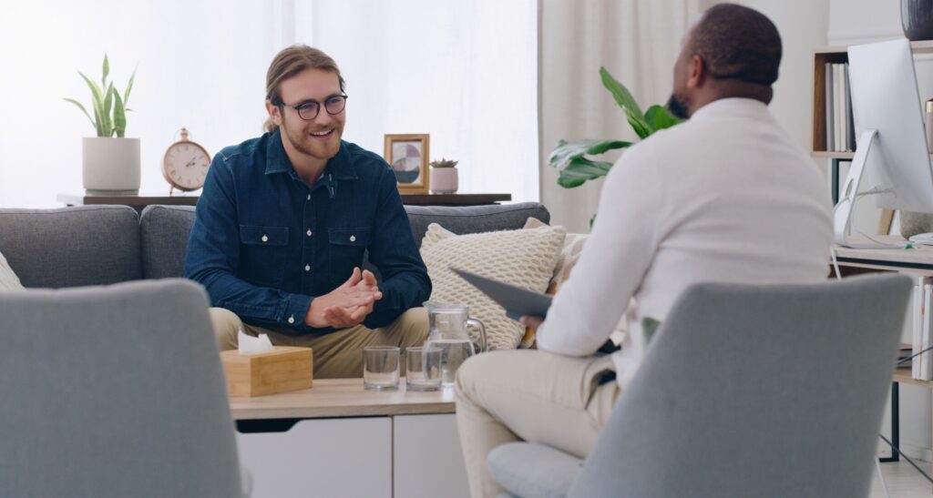 A counselor uses motivational interviewing to help a client.