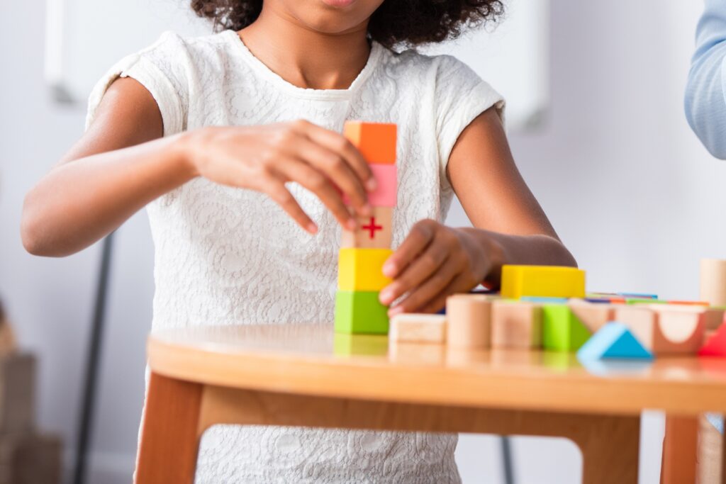 A child engages in play therapy.