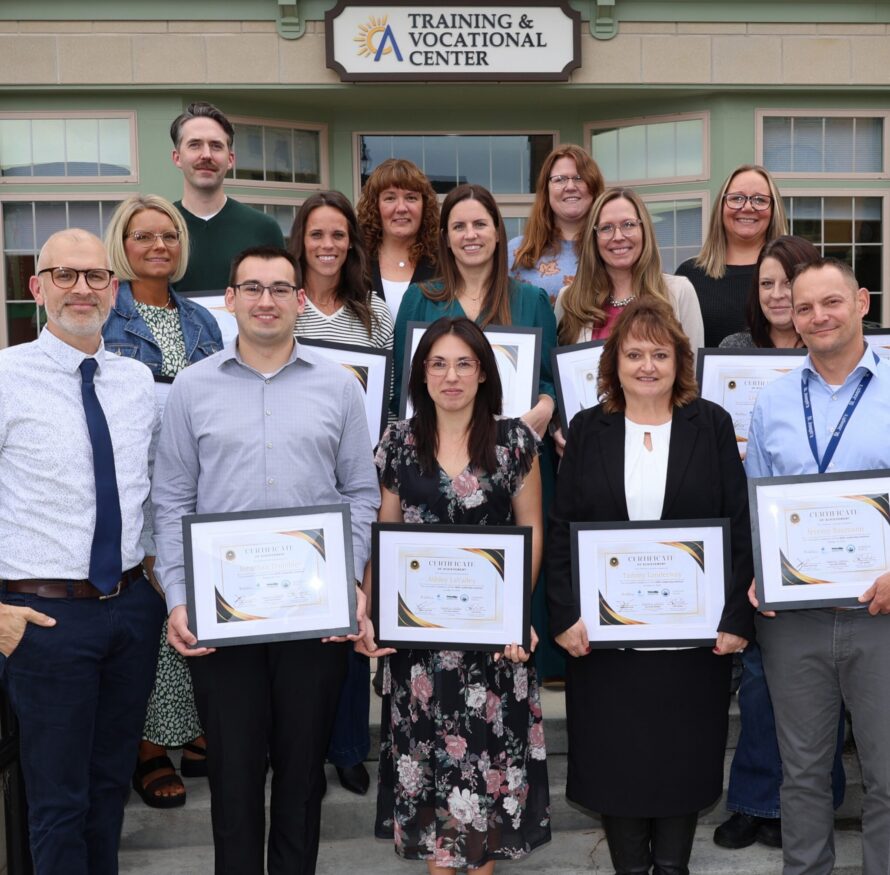 A group of Leadership Institute graduates poses.