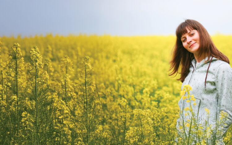 A woman in a field thinks about Behavioral Health Campuses and how they are always open.