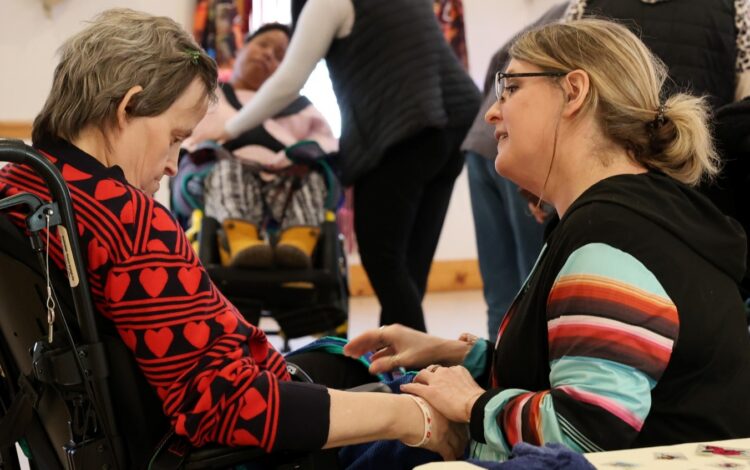 A Community Living manager speaks with a resident.