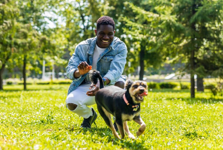 A man and his dog have a great day in the park, the result of changes brought on by cognitive processing therapy.