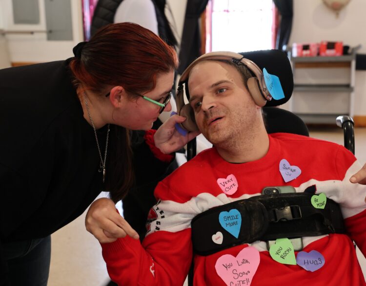 An OPWDD Supervised and Supportive Housing participant enjoys a Valentine's Party.