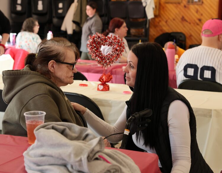 An OPWDD Supervised and Supportive Housing participant enjoys a Valentine's Party.