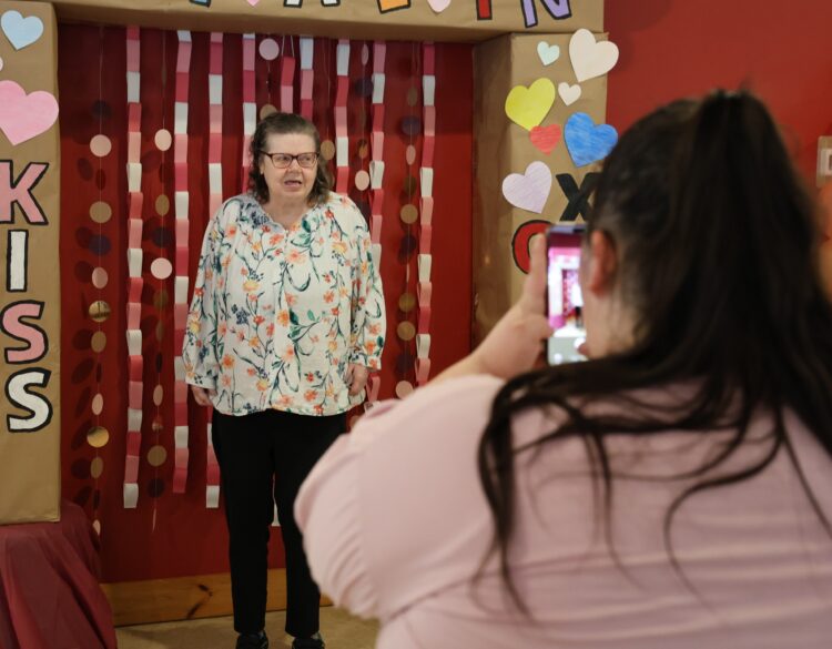 An OPWDD Supervised and Supportive Housing participant enjoys a Valentine's Party.