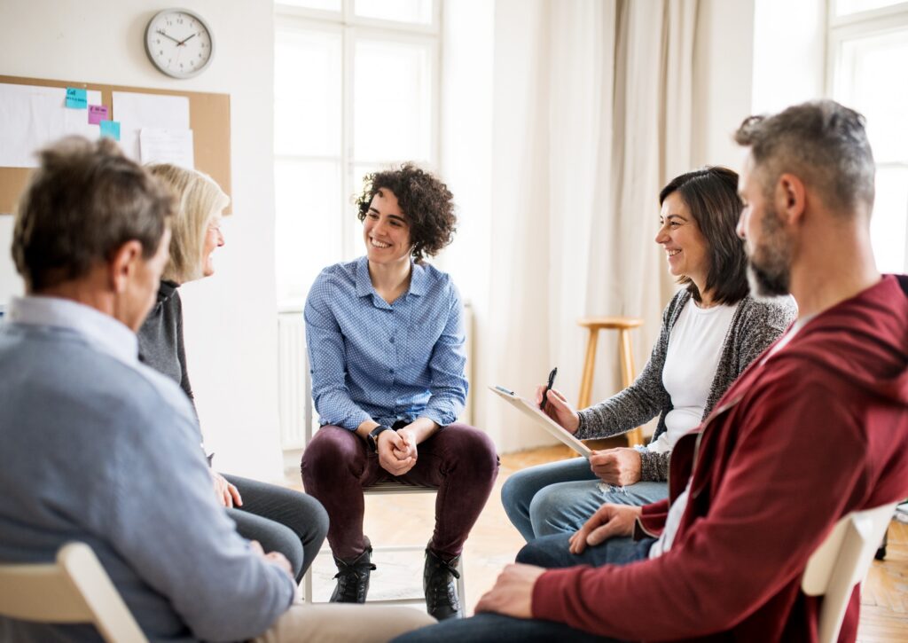 A group therapy session discusses the topic: Why Do I Keep Relapsing?