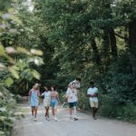 Teenagers walk in nature, symbolizing the importance of early intervention for youth mental health.